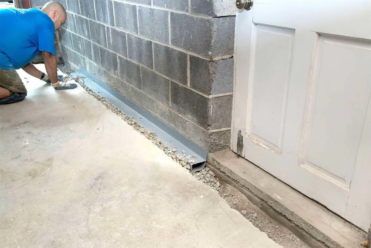 Professional basement drainage channel installation